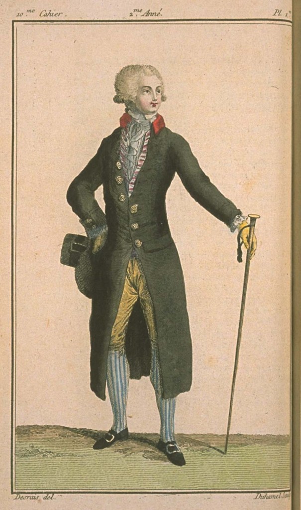 A fashion plate showing a man in a dark coat with a red collar, buff breeches, and striped stockings.